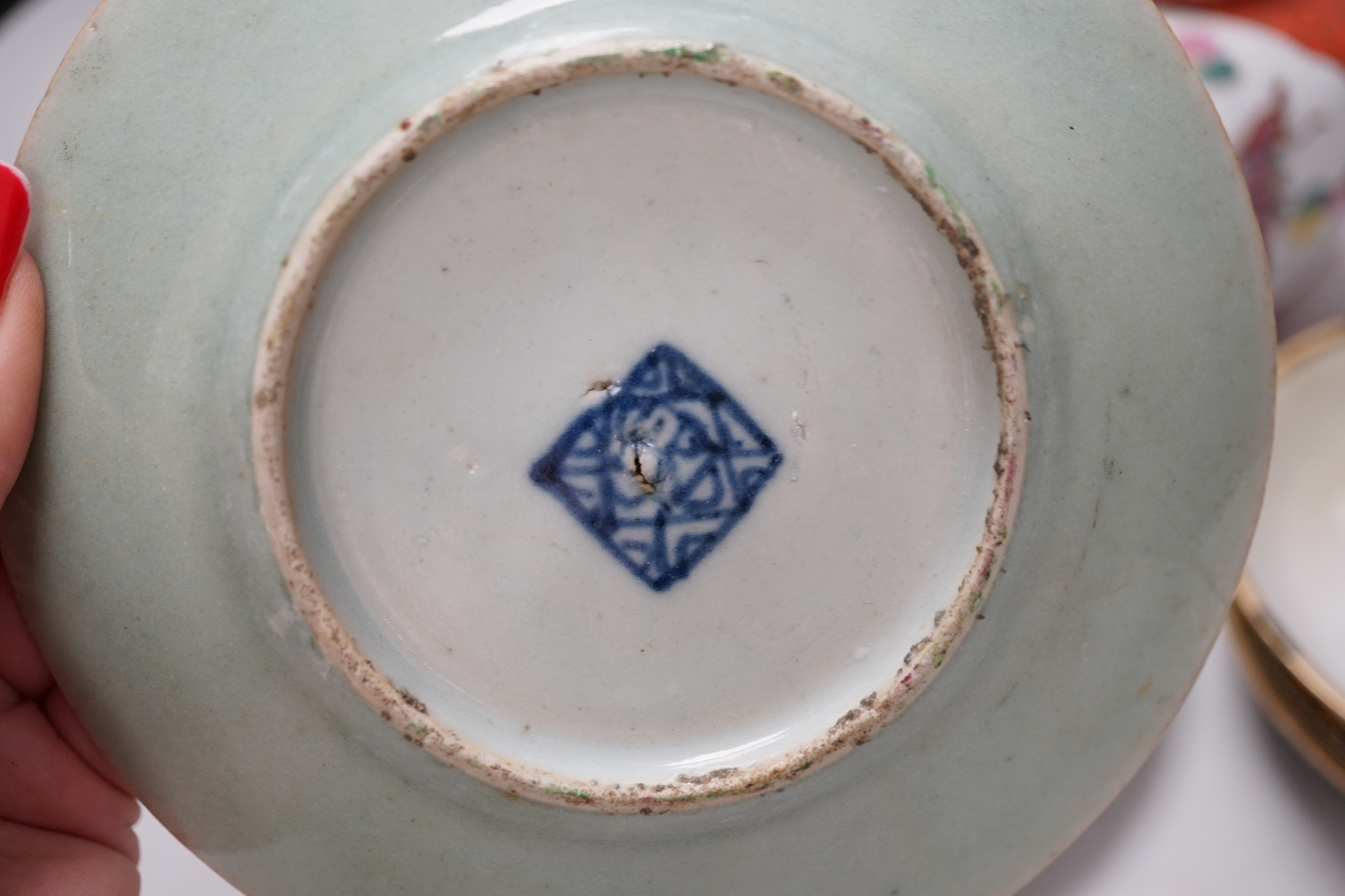 Three Chinese blanc de chine figures, two famille vert plates, a Japanese jar and three eggshell saucers